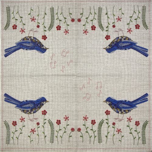 a blue birds and flowers on a white cloth