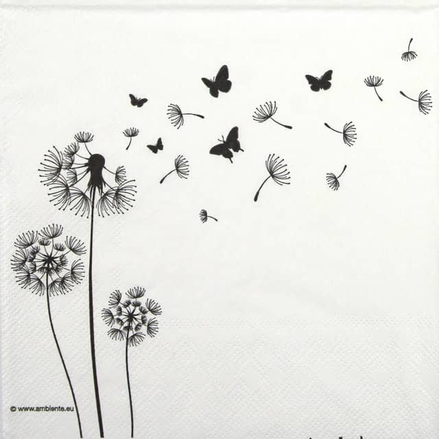 paper napkin with dandelion seeds and butterflies blown away by wind