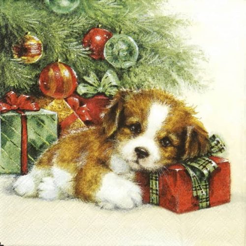 Paper napkin dog under the Christmas tree