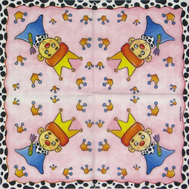 a napkin with cartoon faces and crowns