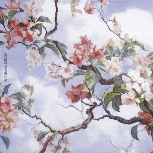 Close-up of PPD Equador napkin – cherry blossom branches and soft pink flowers on a light blue sky