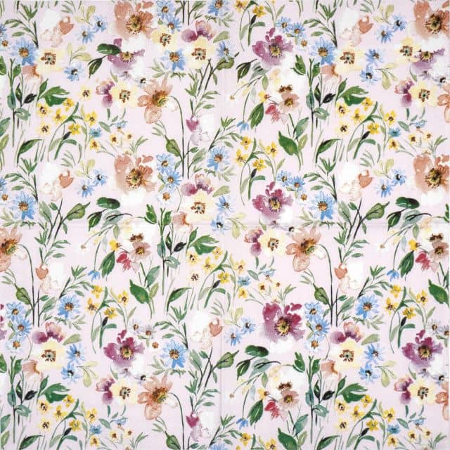 Full view of IHR Beauty of Spring Light-Rose napkin displaying a dense, repeating watercolor floral pattern in pastel pink, purple, blue, and yellow with green leaves on a light rose background.