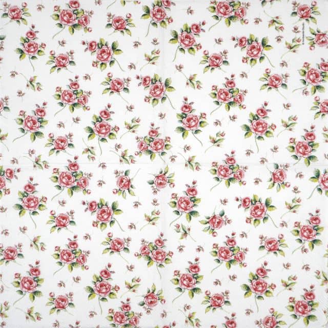 Decoupage napkin featuring a dense, repeating pattern of small red and pink roses with green leaves, scattered across a white background.