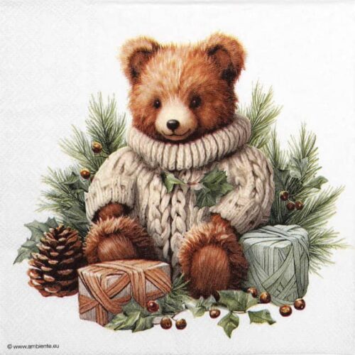 Quarter of a festive paper napkin featuring a cute brown teddy bear in a cream knit sweater, surrounded by pine needles, red berries, and wrapped gifts. Ideal for Christmas decoupage.