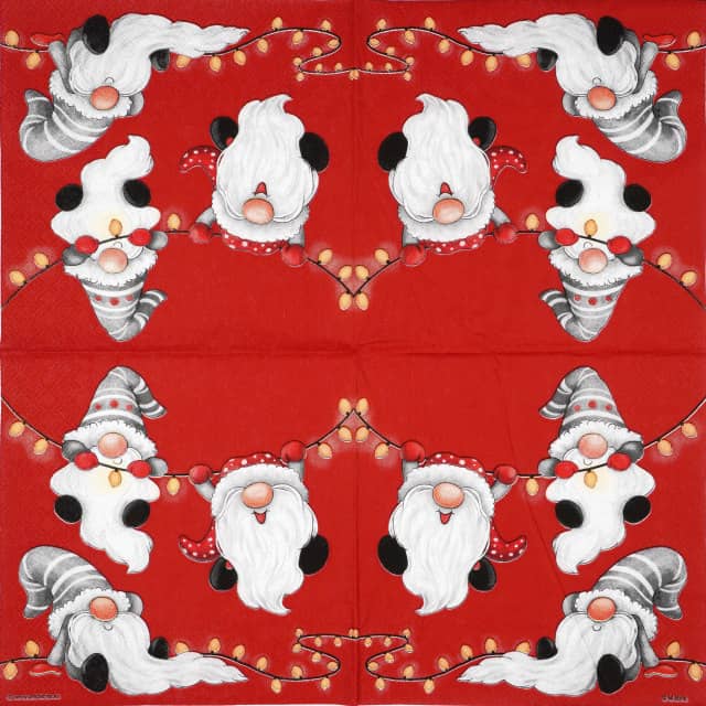 Festive Christmas decoupage napkin with three whimsical gnomes in red and grey hats interacting with a string of golden holiday lights on a vibrant red background. Unfolded napkin.