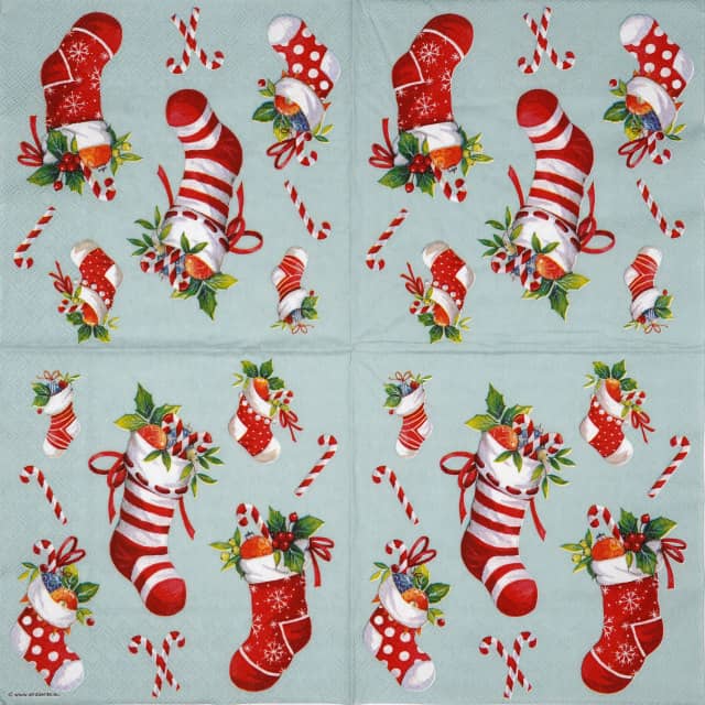 Full napkin design with repeating red and white Christmas stockings filled with candy and holly, along with scattered candy canes on a sage background. Suitable for festive table décor and decoupage.